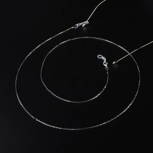 Silver stainless steel box chain glasses strap with silicone loops on black background
