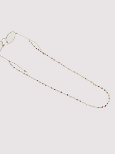 Detail of colorful faceted beads and golden chain for luxury eyewear strap accessory