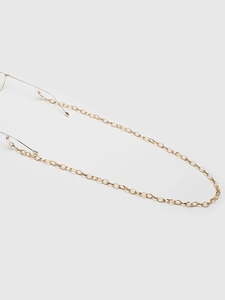 Detail of golden oval link glasses chain with transparent silicone anti-slip ends