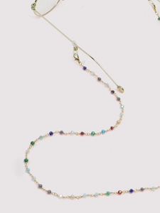 Detail of handmade non-slip glasses chain with colorful crystal beads and gold lobster clasps