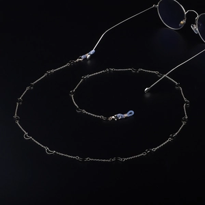 Handmade silver metal glasses chain featuring elegant crescent moon charms and non-slip loops