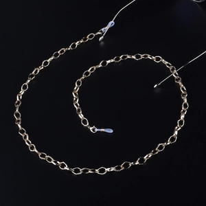 Polished gold metal eyeglass chain with secure silicone loops for fashion eyewear