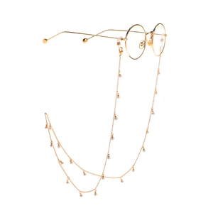 Lunettes rondes dorées élégantes avec une chaîne de lunettes minimaliste à perles nacrées