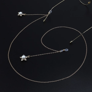 Golden metal eyewear chain with star-shaped pearl pendants and rhinestone accents