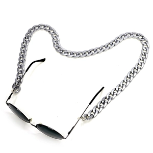 Matte acrylic eyewear chain with oversized silver links and black sunglasses on white background