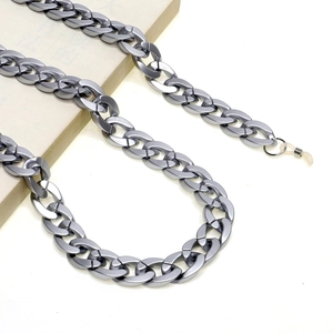 Detail view of a matte silver acrylic eyeglass chain with clear silicone loop connectors
