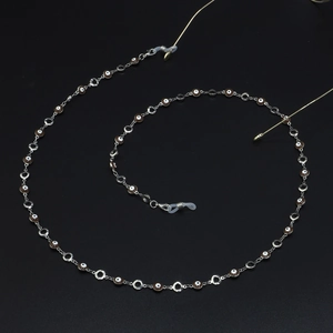Handmade silver metal glasses chain with brown evil eye beads and non-slip silicone loops