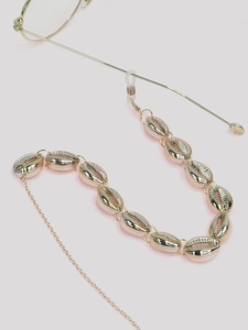 Detail view of golden seashell glasses chain with non-slip silicone loop attachment