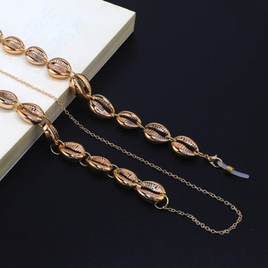 Golden handmade glasses chain with metallic conch shell charms and non-slip rubber loops