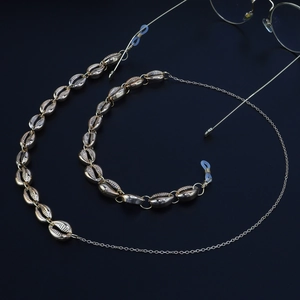 Elegant gold metal glasses chain with shell charms and anti-slip silicone loops
