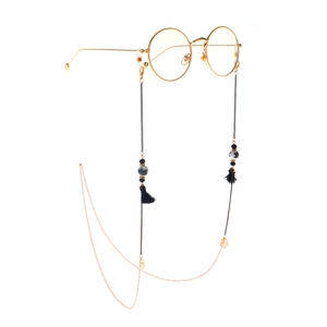 Chic eyewear chain with black tassels and ceramic beads on gold metal frames