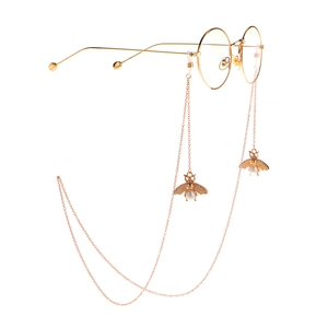Occhiali tondi in metallo dorato con catenella pendente ape e perla stile vintage