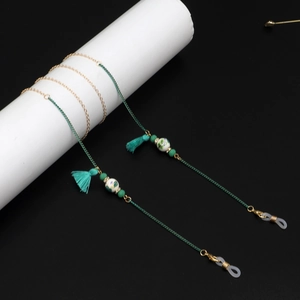 Detail of bohemian eyewear chain with turquoise tassels and colorful ceramic beads
