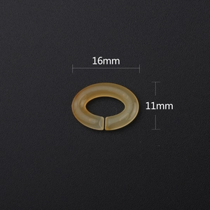 Macro shot of 16x11mm amber acrylic oval open link connector for eyewear chains