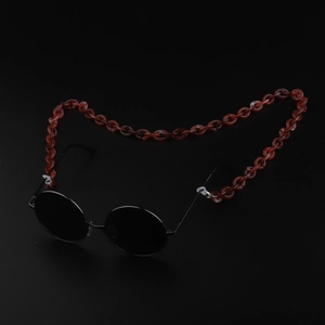 Detailed close-up of amber acrylic eyeglass chain with secure silicone rubber loops