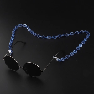 Detailed close-up of blue marble acrylic chain links on eyeglass decorative strap