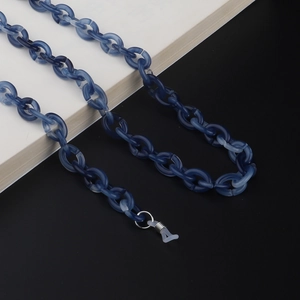 Detailed close-up of blue marble acrylic eyewear chain with secure silicone ends