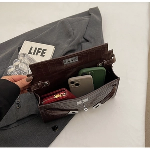 Deep brown crocodile texture handbag interior showing large capacity for phone and wallet