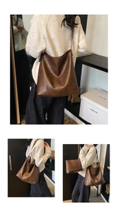Detail view of brown leather tote bag set with matching zipper pouch and strap
