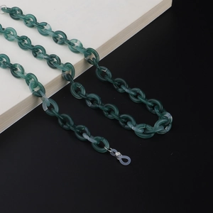 Detail of dark green acrylic eyewear chain with non-slip silicone loops and metal springs