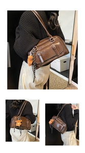 Detail of dark brown faux leather Boston bag with teddy charm and checkered ribbon decoration