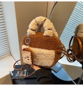 Detailed view of plush teddy fabric texture and toast charm on the brown bowling bag