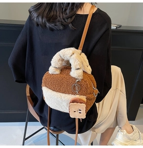 Detailed back view of a plush lamb fleece handbag with a cute toast bread charm