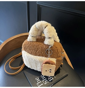 Close-up of fuzzy lamb wool bowling bag with toast plush charm and leather strap