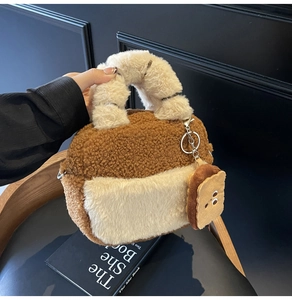Detail of plush lamb wool bowling bag with a cute toast pendant and soft handles