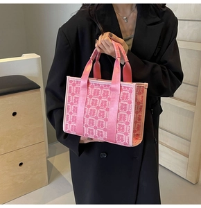 Detail of pink wedding tote bag with traditional Double Happiness embroidery pattern