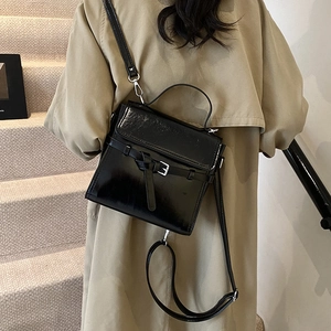 Glossy black leather crossbody bag for women, retro handbag with buckle strap detail