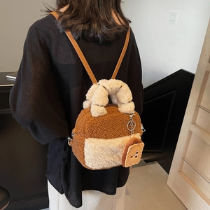 Plush caramel and cream patchwork mini backpack with a cute toast pendant charm