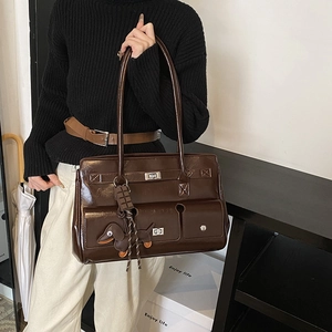 Retro dark brown tote bag with metal twist locks and cute dachshund bag charm
