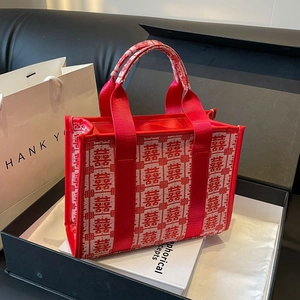Red festive wedding tote bag with white Xi characters embroidery and wide ribbon handles