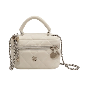 White quilted mini crossbody bag with metal camellia logo and chain strap for summer