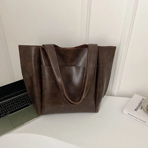 Grande borsa tote marrone minimalista con tasca frontale per il pendolarismo e stile casual