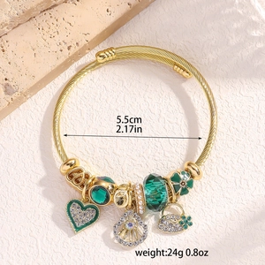 Close-up of golden twisted rope bangle with heart and clover charms, size 5.5cm 24g