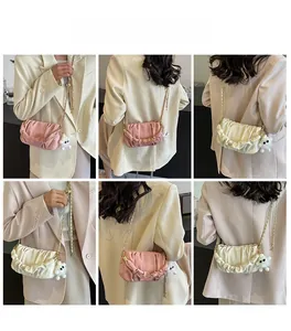 Collage of pleated shoulder bags with chain straps and plush charm worn by a model