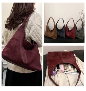 Detail view of large capacity matte shoulder bucket bag with white stitching and four colors