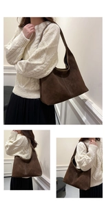 Detail of white double stitching on vintage brown suede leather large tote bag
