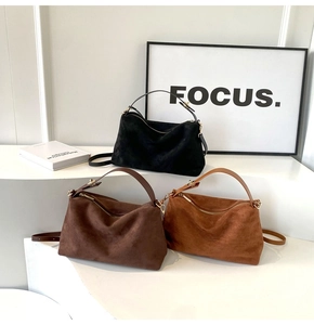 Three minimalist matte suede shoulder bags in black, dark brown, and caramel colors