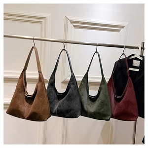 Detailed close-up of retro hobo bags in four colors with visible white stitching details