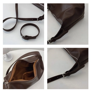 Macro detail of dark brown pebble leather shoulder bag with zipper and metal buckle