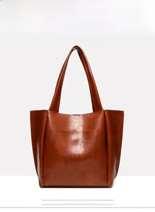 Front view of brown vintage leather tote bag with large capacity and shoulder straps