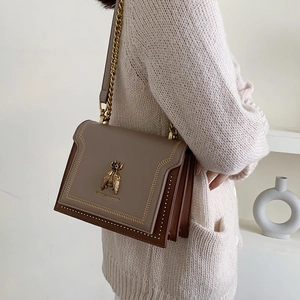 Vintage style bee crossbody bag with chain strap and contrast stitching details