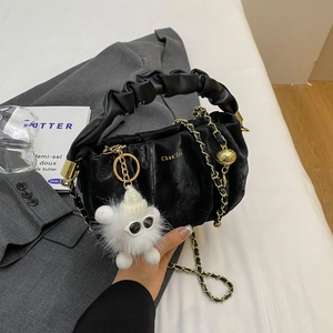 Fashionable black pleated cloud handbag with gold chain strap and fluffy charm