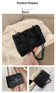 Detail view of black quilted chain bag with small metal studs and geometric pattern