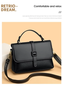 Detail of black messenger bag featuring contrast stitching and mixed leather textures