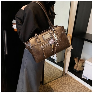 Retro brown oversized tote bag in faux leather shown on model for daily commute style