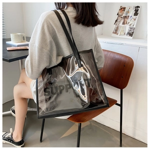 Detail of transparent PVC tote bag with black SUPPORT logo and matching inner pouch